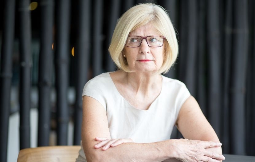 A senior woman feeling uncertainty
