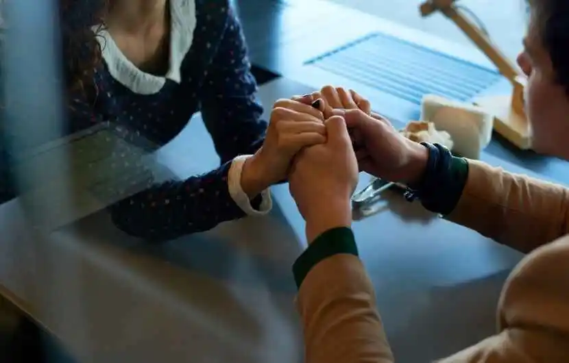 couple put hands together to touch each other
