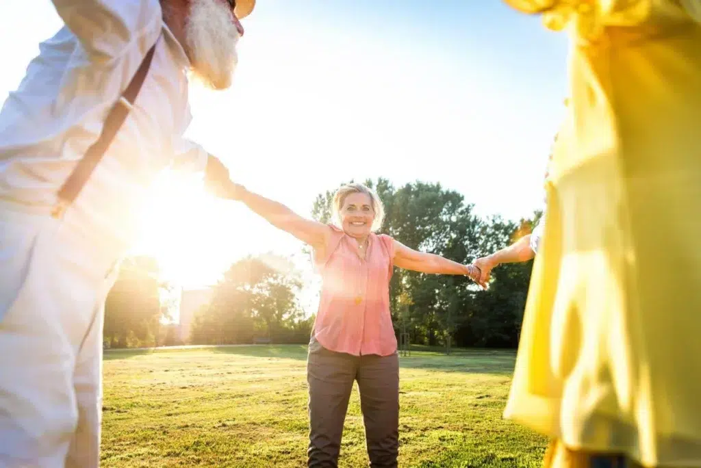 Group of senior people bonding outdoors in the garden