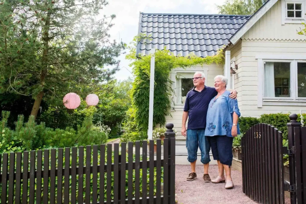 Senior man and woman standing in garden