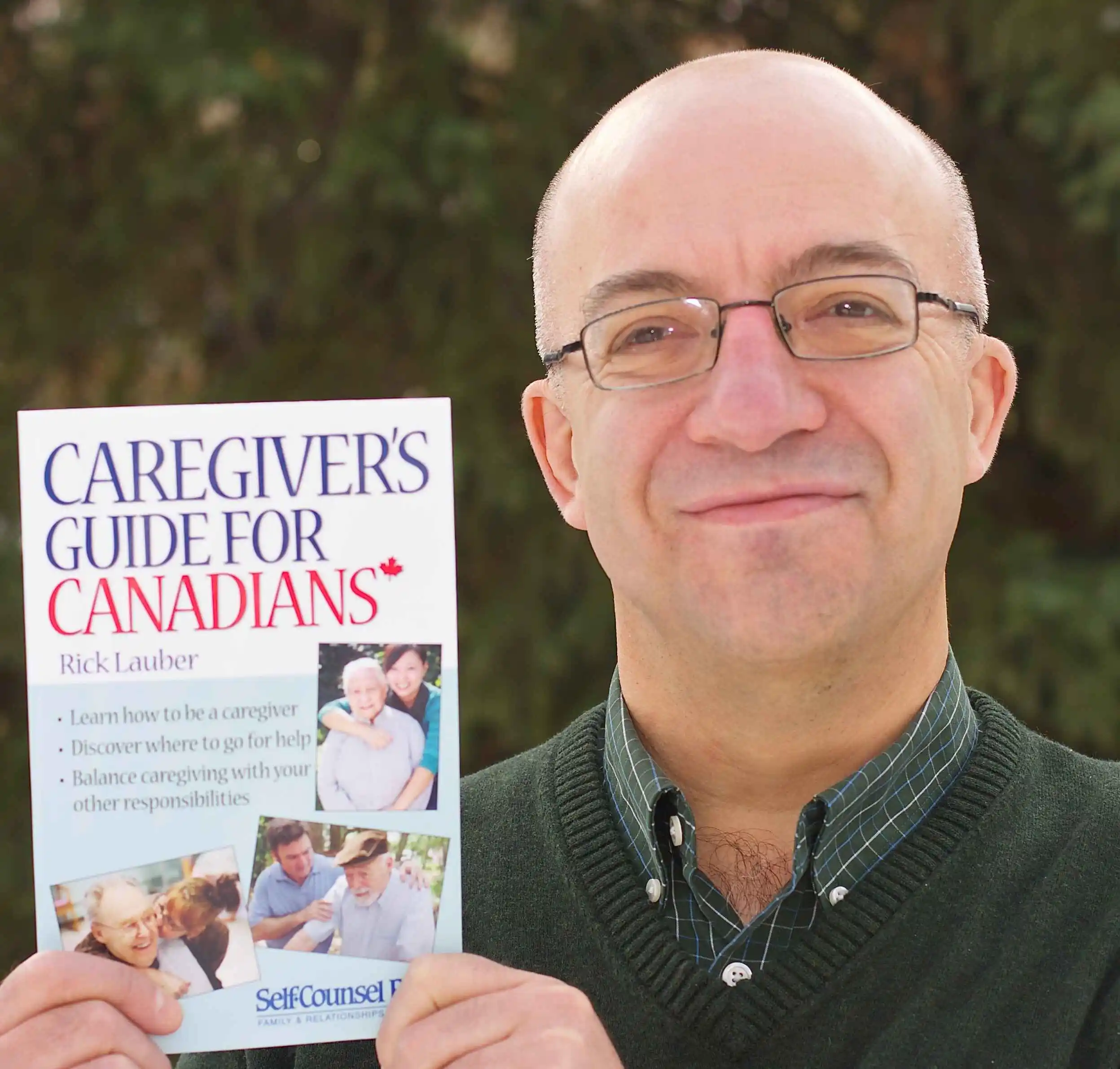 Rick Lauber with his book - Tips For Caregiving From Afar